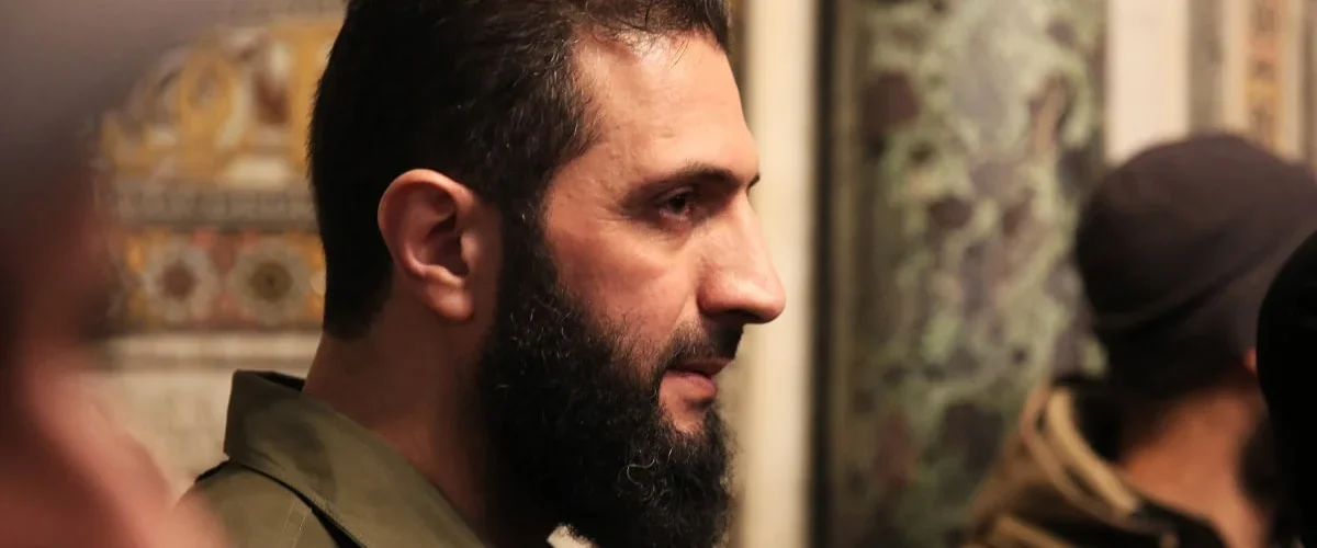 Jolani's vision for Syria focuses on reform, inclusivity, and distancing from the Taliban model, as the U.S. cautiously engages with HTS leadership. [Image via NBC News]