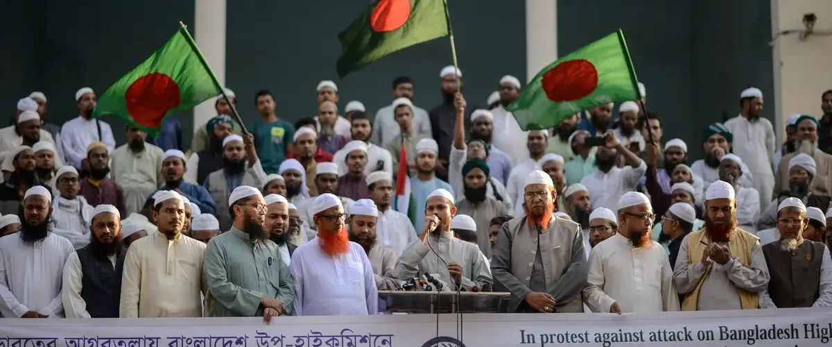 Bangladesh summons India's envoy after consular building attack amid rising tensions over Hasina's ouster and Hindu minority protests. [Image via DW]