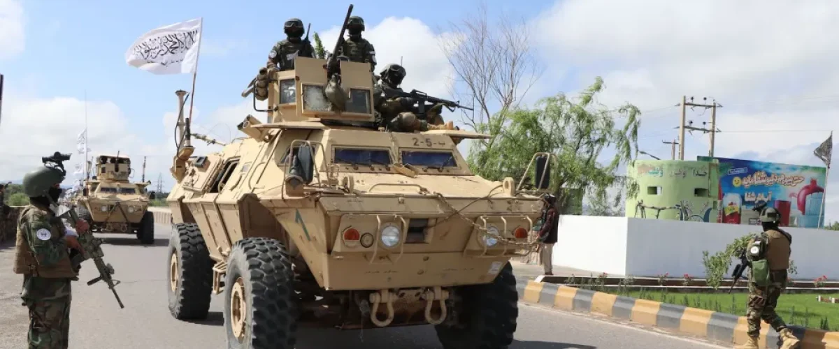 Taliban fighters in armored vehicles, armed with America’s abandoned arsenal in Afghanistan, take part in a military street parade in Herat, Afghanistan, on April 19. [Image via AFP via Getty Images].