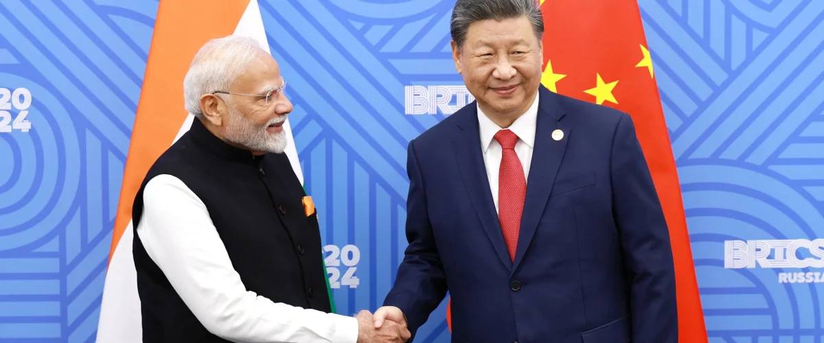 Chinese President Xi and Indian PM Modi discuss boosting communication and cooperation to improve ties after military clashes.