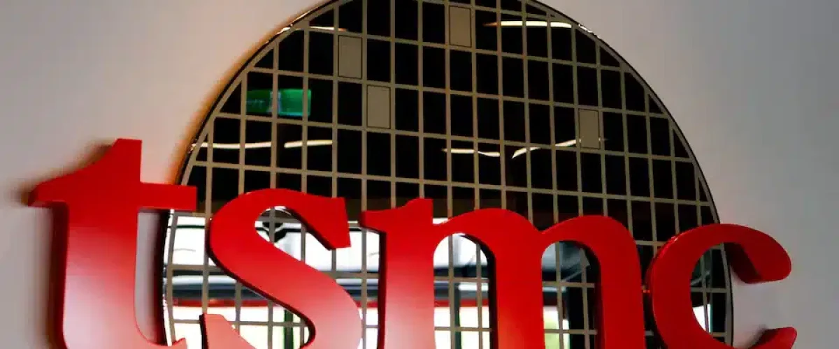 Trump warns TSMC of 100% tax if it doesn't build U.S. factories, criticizes Biden's $6.6B grant for semiconductor production. [Image via Reuters/File]
