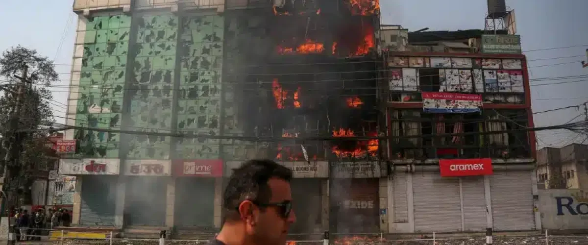 Tinkune protest for Hindu Kingdom turns deadly; 2 killed, 120+ injured, locals await aid for major property losses. [Image via The Kathmandu Post/ File]